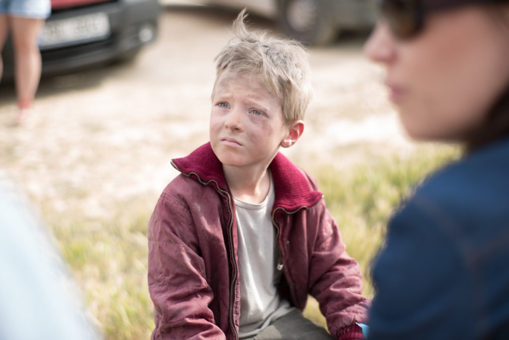 Blond worried kid with dirty face